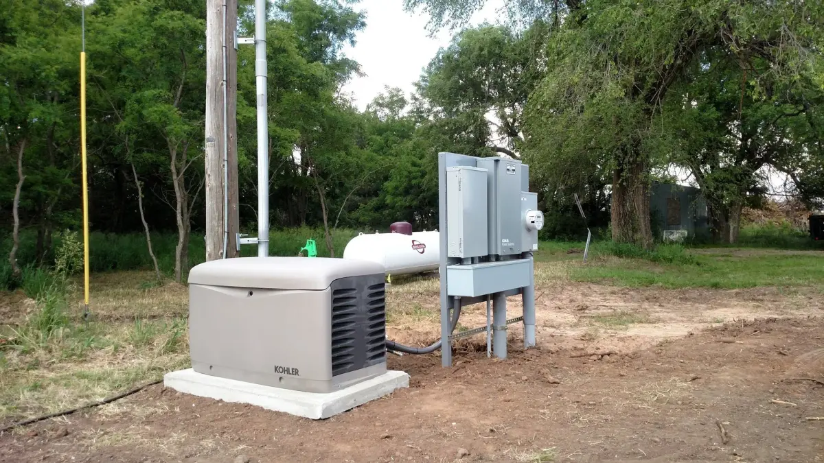 Frontier Electric LLC technician completing a standby generator installation at a residential property in central Kansas